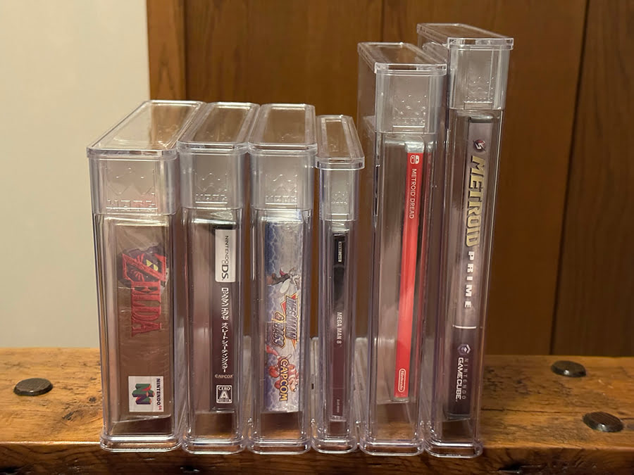 Six reholdered games from the side, showing slimmer profile for storage
